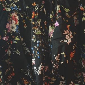 On Vacation till July 12 Cute floral ruffle skirt. Black, fits 1X-2X. EUC